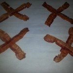 lay your partially cooked bacon on a tray in a X formation. 