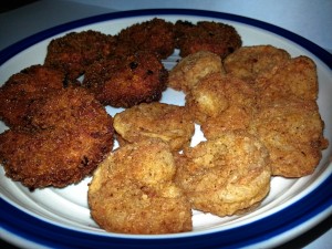 The shrimp to the left, that are darker in color are breaded with flour and panko breadcrumbs. The lighter colored shrimp to the right are coated only in flour. 