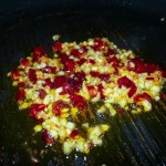 Sauteing arbol chili peppers and garlic